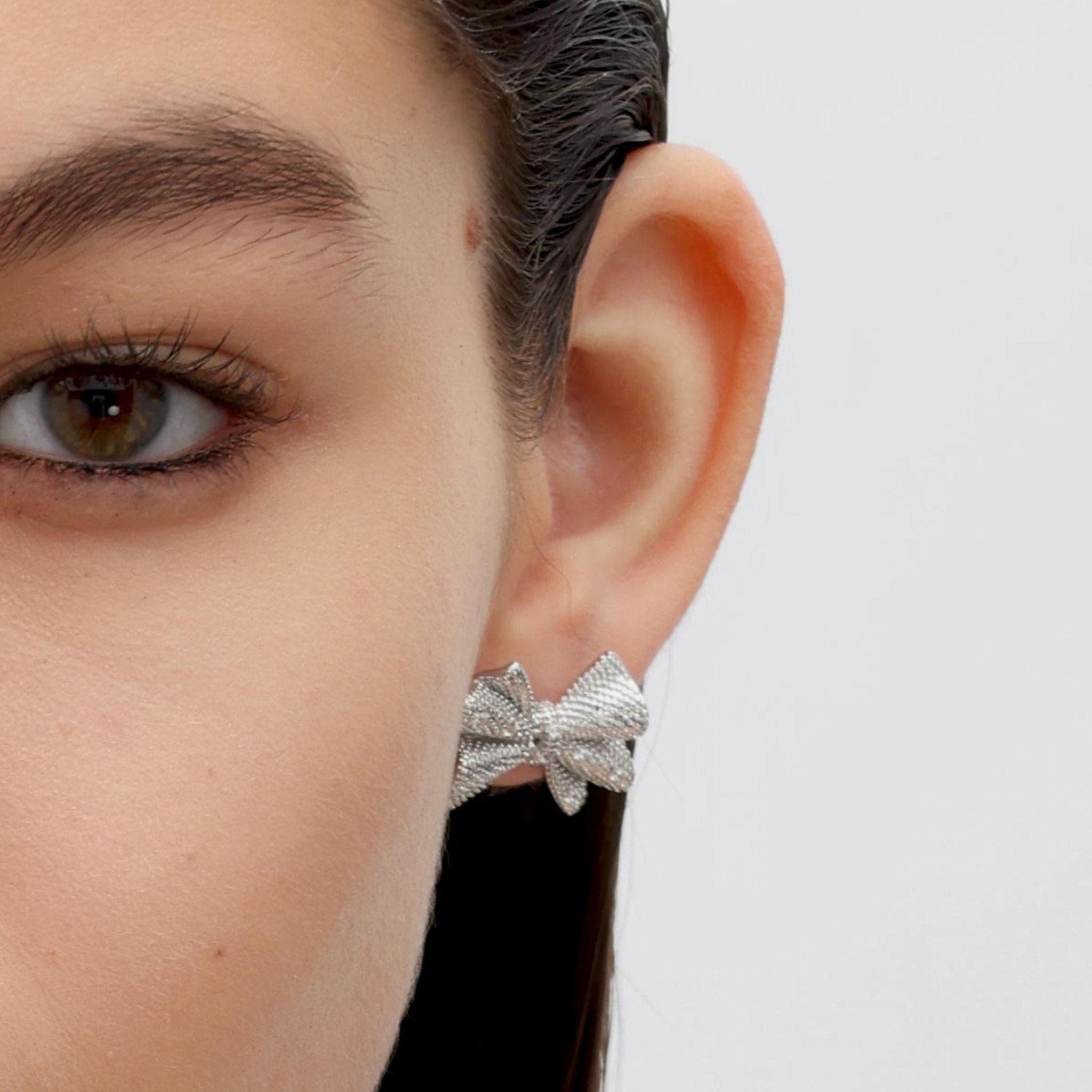 RSNY shiny bow stud earrings - R2183A